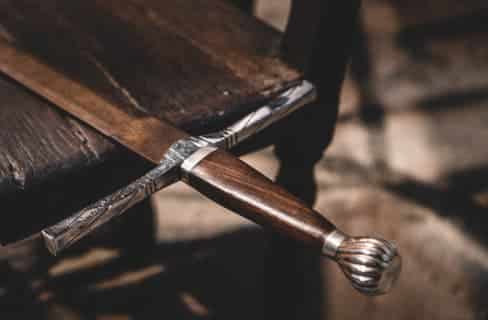 image of sword laying on table